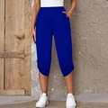 Detail of dark blue women's capris showing elastic waist and silver button decorations - S / Blue