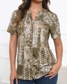 Close-up of olive green floral leaf print and natural wood buttons on the linen shirt - S / Khaki
