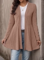 Detail of dusty pink ribbed knit cardigan featuring a ruffled peplum hem and long sleeves - Watermelon red