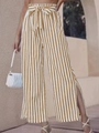 Close-up of high-waist striped wide-leg pants with bow-knot tie and side leg slits - Khaki