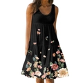 Detalle de estampado floral vintage y dobladillo con volantes en un vestido negro de verano - Negro + Flores Amarillas