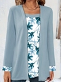Close-up of light blue ribbed cardigan over white floral print inner top with folded cuffs - Sky Blue