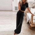 Zweiteiliges Damen-Lounge-Set aus schwarzem Rippstrick mit Crop Top und weiter Hose - S / Schwarz