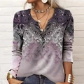 Close-up of bohemian paisley print on women's V-neck long sleeve shirt with buttons - Pink
