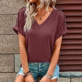 Detail of burgundy V-neck T-shirt showing button decoration and rolled sleeves - Burgundy