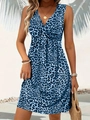 Close-up of leopard print mini dress featuring a V-neckline and twist knot front detail - Blue