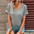 Detail of grey V-neck t-shirt featuring rolled sleeves and textured dark buttons - Light Gray