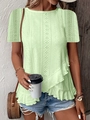 Detail of mint green short sleeve top featuring eyelet embroidery and ruffled hemline - Fluorescent Green