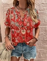 Detail of red floral print bohemian top featuring a V-neck and decorative front buttons - S / Floral Red