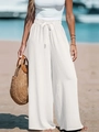 Dettaglio dei pantaloni di lino bianchi a vita alta con coulisse elastica e stile mare - Bianco
