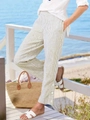 Detail of light olive striped pants featuring loose elastic waist and buttoned ankles - S / Khaki