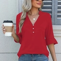 Detail of dark red V-neck blouse featuring pearl buttons and ruffled five-point sleeves - Burgundy