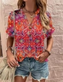 Detail of V-neck short sleeve top with colorful Bohemian print and dark buttons - Mandala Pink