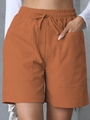 Women's linen drawstring shorts in caramel orange with large functional front pockets - Brown