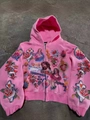 Detail of pink hoodie with religious art prints featuring Jesus portrait and roses - Rose Red