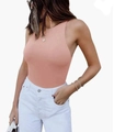 Side view of peach pink sleeveless racerback bodysuit paired with white denim jeans - Pink
