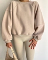 Close-up of oatmeal crewneck sweatshirt and ribbed leggings fabric texture details - Camel