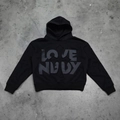 Detailed close-up of the grey LOVE NEEDY cross print on a black oversized hoodie - M / LOVE NEEDY Print (5061292725716) / Black
