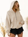 Detail of half-zip beige hoodie featuring a drop shoulder design and kangaroo pocket - S / Apricot