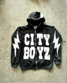 Flat lay of black hoodie featuring white CITY BOYZ patch and lightning sleeve graphics - M / Black