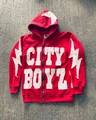 Macro shot of red hoodie with heavy fabric texture, patch letters and star zipper pull - M / Red