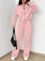 Pink tracksuit detail showing zipper jacket and drawstring pants on model in studio - S / Pink