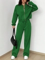 Detail of the vibrant green two-piece tracksuit with zipper hoodie and loose pants - S / Green