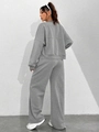 Detailed back view of a grey casual two-piece tracksuit featuring loose wide-leg joggers - S / Gray
