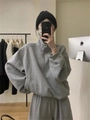 Detail showing the gray half-zip stand collar hoodie and loose matching sweatpants set - M / Top And Bottom / Gray