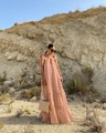 Close-up of pink tulle maxi dress featuring 3D floral textures and a tiered ruffle design - Pink
