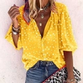 Detail of yellow polka dot V-neck shirt showing front buttons and lantern sleeve texture - S / Tops / Yellow