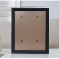 Minimalist black wooden picture frame with brown fiberboard back and metal clips - Black / Large