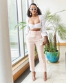 Women's chic light pink high-waisted suit pants with a matching belt and white crop top - Off White