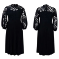 Detail of black midi dress showing intricate lace hollow-out sleeves and pleated A-line skirt - Black with Belt