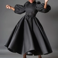 Detail of elegant black satin plus size dress with puff sleeves and flared pleated hem - S / Black