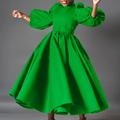 Detail of bright green long sleeve dress featuring puffy lantern sleeves and a belted waist - S / Green