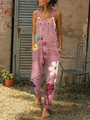 Detail der rosa geblümten Jeans-Latzhose mit bunten Gänseblümchen-Prints und großer Tasche - 3XL / Rosa