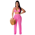 Detail of bright pink crochet knit set showing ripple hollow patterns on high waist trousers - Pink