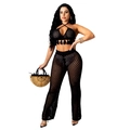 Detail of black crochet two-piece set featuring hollow mesh texture and tassel hem - Black