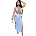 Close-up of white crochet knit beach set featuring cutout maxi skirt and halter bikini top - White