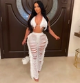 Dettaglio del top a fessura bianco e dei pantaloni a vita alta con frange da donna - S / Bianco