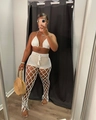Detail of white crochet hollow three-piece beach set with fishnet pants and drawstring shorts - White