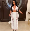 Close-up of white knit two-piece set with deep V-neck halter top and fringe hollow skirt - S / Top And Bottom / White