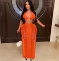 Detail of neon orange crochet knit two-piece set featuring long fringe and side cut-outs - S / Top And Bottom / Orange
