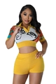 Detail of knitted crop top showing abstract face pattern and polo collar with buttons - Yellow