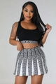 Detail of knitted Greek Key pattern on black and white cropped top and high waist skirt set - S / Black