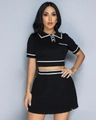Close-up of knit two-piece set featuring contrast white trim and polo neck details - Black