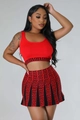 Close-up of red knitted two-piece set with black Greek key pattern on crop top and skirt - S / Red