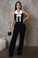 Close-up of contrast white collar and oversized bow detail on black workout jumpsuit - S / Black