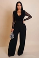 Detail van elegante jumpsuit met V-hals, mesh mouwen met ruches en wijde pijpen fit - S / Zwart
